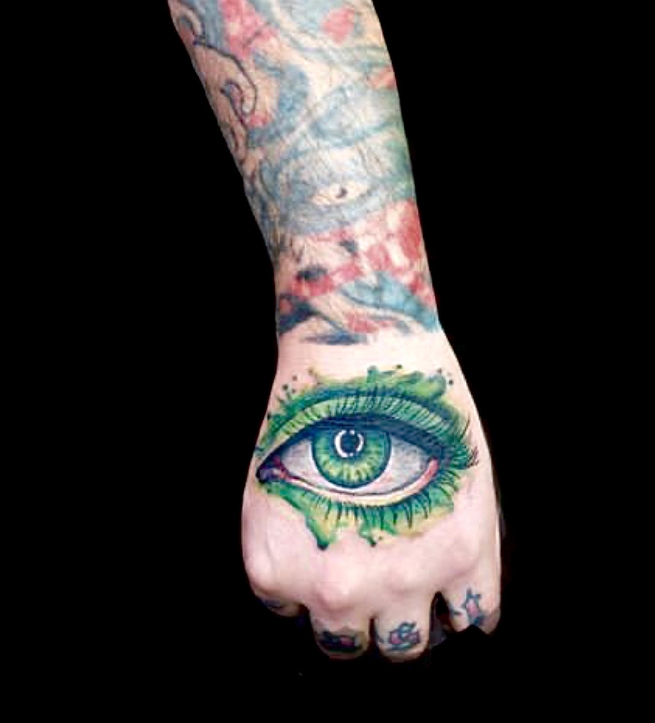watercolor explosion eye tattoo